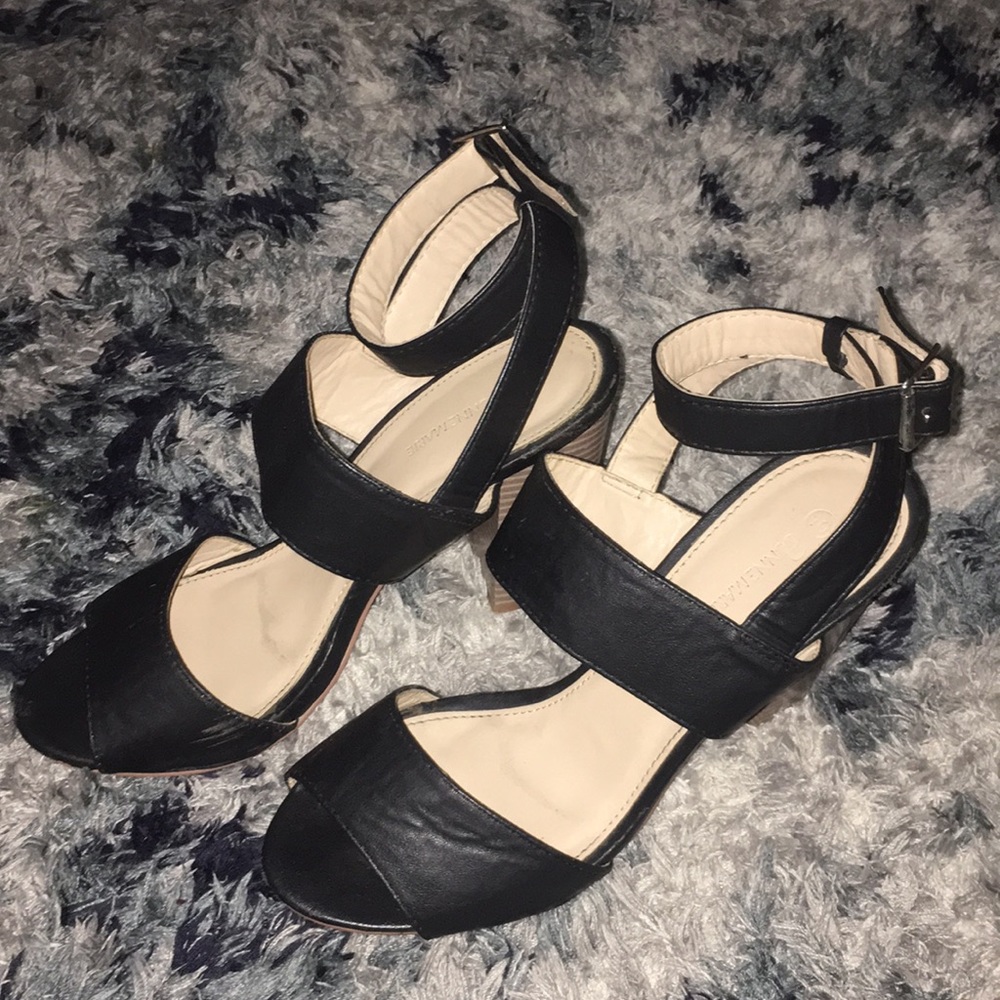 Black strapped snarled heels